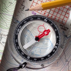 Compass on topographic maps wtih rope climbing and pencil.Similar photographs from my portfolio: